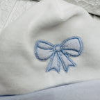 Cappello e babbucce fiocco celeste