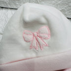 Cappello e babbucce ciniglia fiocco rosa