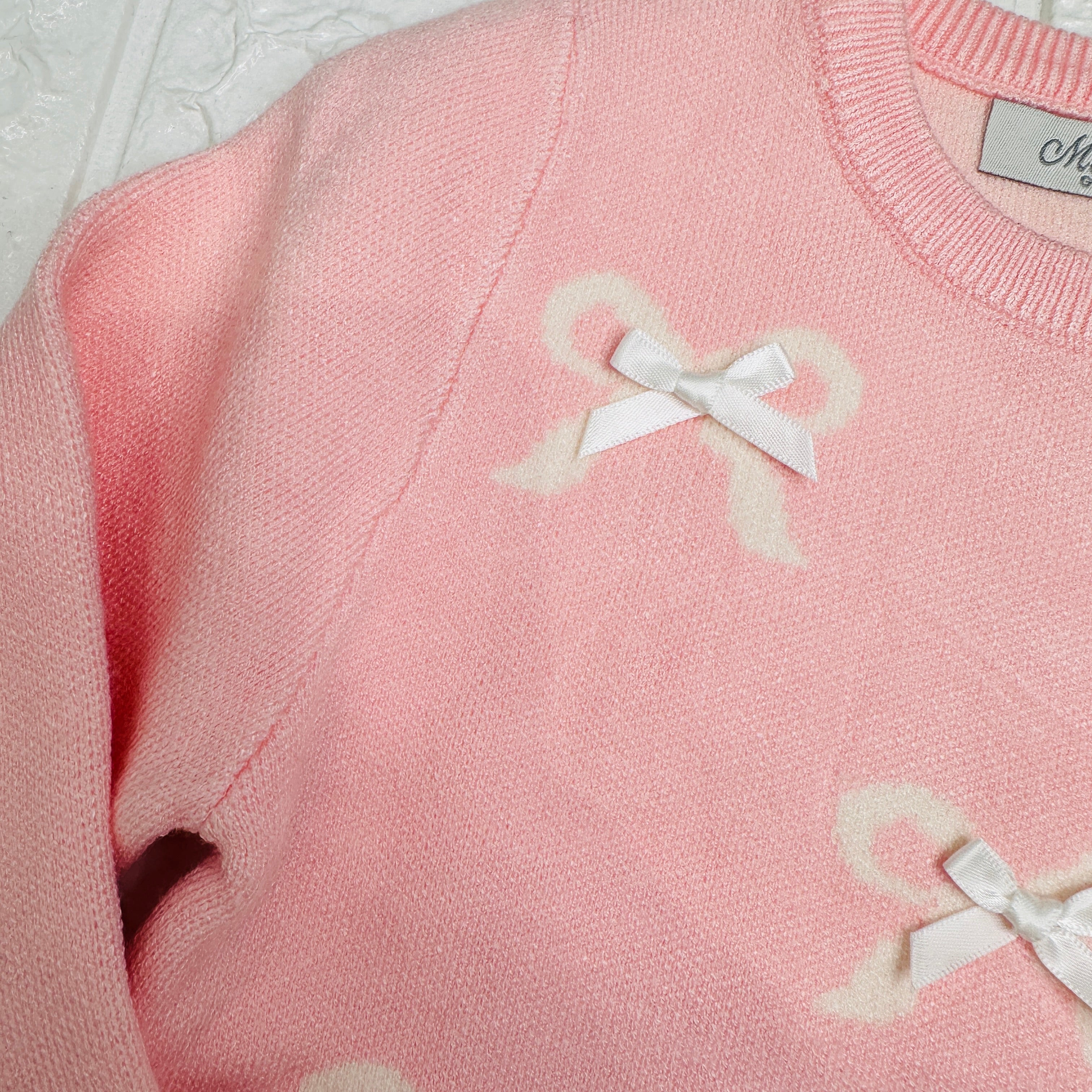 Maglioncino fiocchetti rosa